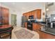 Modern kitchen with stainless steel appliances and wood cabinets at 108 Savona Ct, North Venice, FL 34275