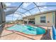 Relaxing pool and spa with covered patio at 108 Savona Ct, North Venice, FL 34275