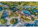 Aerial view of community with clubhouse, pool, and tennis courts at 11136 Shearwater Ct, Sarasota, FL 34238