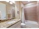 Clean bathroom with granite countertop and tub shower combo at 11136 Shearwater Ct, Sarasota, FL 34238