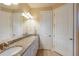 Double vanity bathroom with granite countertop and large mirror at 11136 Shearwater Ct, Sarasota, FL 34238