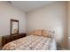 Well-lit bedroom with a double bed and wooden dresser at 11136 Shearwater Ct, Sarasota, FL 34238