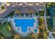 Aerial view of community pool with lounge chairs at 11136 Shearwater Ct, Sarasota, FL 34238