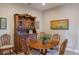 Charming dining area with a wooden table and hutch at 11136 Shearwater Ct, Sarasota, FL 34238