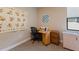 Bright office space with desk, chair, and wall art at 11136 Shearwater Ct, Sarasota, FL 34238