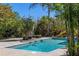 Relaxing pool area with tropical landscaping at 117 S Polk Dr, Sarasota, FL 34236