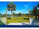 Peaceful backyard with pond and lush vegetation at 1226 Coral Ridge Dr, Punta Gorda, FL 33950