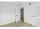 Bedroom with tile floors and access to hallway bathroom at 1226 Coral Ridge Dr, Punta Gorda, FL 33950