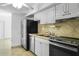 Kitchen with stainless steel appliances and light-colored cabinets at 1226 Coral Ridge Dr, Punta Gorda, FL 33950