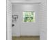 Laundry room with window, tile floor and built-in cabinets at 1226 Coral Ridge Dr, Punta Gorda, FL 33950