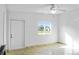 Bright and airy living room with tile flooring, a ceiling fan, and a modern electric fireplace at 1226 Coral Ridge Dr, Punta Gorda, FL 33950