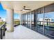 Spacious balcony with tiled floor, ceiling fan, and sliding glass doors offering stunning views at 1281 Gulf Of Mexico Dr # 404, Longboat Key, FL 34228