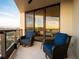 Relaxing balcony with two wicker chairs and stunning ocean view at 1281 Gulf Of Mexico Dr # 404, Longboat Key, FL 34228