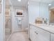 Guest bathroom with shower and single vanity at 1281 Gulf Of Mexico Dr # 404, Longboat Key, FL 34228