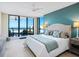 Main bedroom with ocean view, king-size bed, and ensuite bathroom at 1281 Gulf Of Mexico Dr # 404, Longboat Key, FL 34228