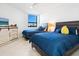 Guest bedroom with two twin beds and ocean view at 1281 Gulf Of Mexico Dr # 404, Longboat Key, FL 34228