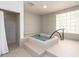 Soothing hot tub with tiled walls and a safety rail at 1281 Gulf Of Mexico Dr # 404, Longboat Key, FL 34228