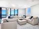 Bright living room featuring a large sectional sofa and ocean views at 1281 Gulf Of Mexico Dr # 404, Longboat Key, FL 34228