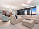 Modern living room with sectional sofa and ocean views at sunset at 1281 Gulf Of Mexico Dr # 404, Longboat Key, FL 34228