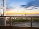 Breathtaking sunset view over ocean from balcony, tennis courts below at 1281 Gulf Of Mexico Dr # 404, Longboat Key, FL 34228