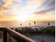 Breathtaking sunset over the ocean, beach, and tennis courts at 1281 Gulf Of Mexico Dr # 404, Longboat Key, FL 34228