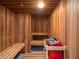 Relaxing sauna with wooden benches and a stone heater at 1281 Gulf Of Mexico Dr # 404, Longboat Key, FL 34228