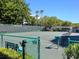 Well-maintained tennis court with green surface and fencing at 1281 Gulf Of Mexico Dr # 404, Longboat Key, FL 34228