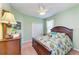 Bright bedroom with wood furniture and ceiling fan at 12904 49Th E Ln, Parrish, FL 34219