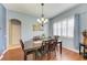 Formal dining room with hardwood floors, chandelier, and large windows at 12904 49Th E Ln, Parrish, FL 34219