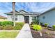 Welcoming entryway with landscaped gardens and a charming walkway at 12904 49Th E Ln, Parrish, FL 34219