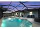 Enclosed pool area with a covered patio and grill at 12904 49Th E Ln, Parrish, FL 34219