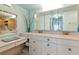 Bathroom with double vanity and decorative mirror at 1341 Perico Point Cir # 116, Bradenton, FL 34209