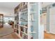 Tall, white bookcase separating living and kitchen areas at 1341 Perico Point Cir # 116, Bradenton, FL 34209