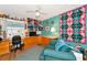 Bright craft room with teal walls, built-ins, and comfy seating at 1341 Perico Point Cir # 116, Bradenton, FL 34209