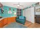 Well-lit craft room with teal walls, ample storage, and cozy seating at 1341 Perico Point Cir # 116, Bradenton, FL 34209