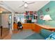 Craft room with built-in workspace and teal walls at 1341 Perico Point Cir # 116, Bradenton, FL 34209