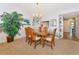 Formal dining room with an oval glass-top table and chandelier at 1341 Perico Point Cir # 116, Bradenton, FL 34209