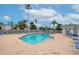 Community pool with lounge chairs and a hot tub at 1341 Perico Point Cir # 116, Bradenton, FL 34209