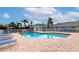 Community pool with plenty of lounge chairs at 1341 Perico Point Cir # 116, Bradenton, FL 34209