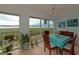 Bright sunroom, water views, and dining table for enjoying the view at 1341 Perico Point Cir # 116, Bradenton, FL 34209