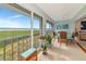 Sunroom with ample natural light and scenic water views at 1341 Perico Point Cir # 116, Bradenton, FL 34209