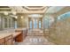 Luxurious bathroom with double vanity, soaking tub and large shower at 13616 Legends Walk Ter, Lakewood Ranch, FL 34202