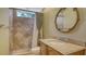 Bathroom with shower, tile surround, and a vanity with a large mirror at 13616 Legends Walk Ter, Lakewood Ranch, FL 34202