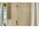 Clean bathroom with shower/tub combo and white subway tile at 13616 Legends Walk Ter, Lakewood Ranch, FL 34202