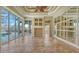 Gathering room with tile floors, mirrors, and access to the pool area at 13616 Legends Walk Ter, Lakewood Ranch, FL 34202