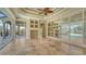 Gathering room showcasing tile floors, built-in shelving, and pool access at 13616 Legends Walk Ter, Lakewood Ranch, FL 34202