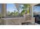 Outdoor kitchen with built-in grill and screened enclosure at 13616 Legends Walk Ter, Lakewood Ranch, FL 34202