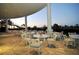 Outdoor patio area with white metal tables and chairs at 13616 Legends Walk Ter, Lakewood Ranch, FL 34202