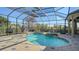 Inviting screened pool area with a spa and outdoor entertaining space at 13616 Legends Walk Ter, Lakewood Ranch, FL 34202