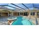 Resort-style pool with covered patio and access to the interior at 13616 Legends Walk Ter, Lakewood Ranch, FL 34202